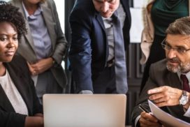 business team looking at a computer
